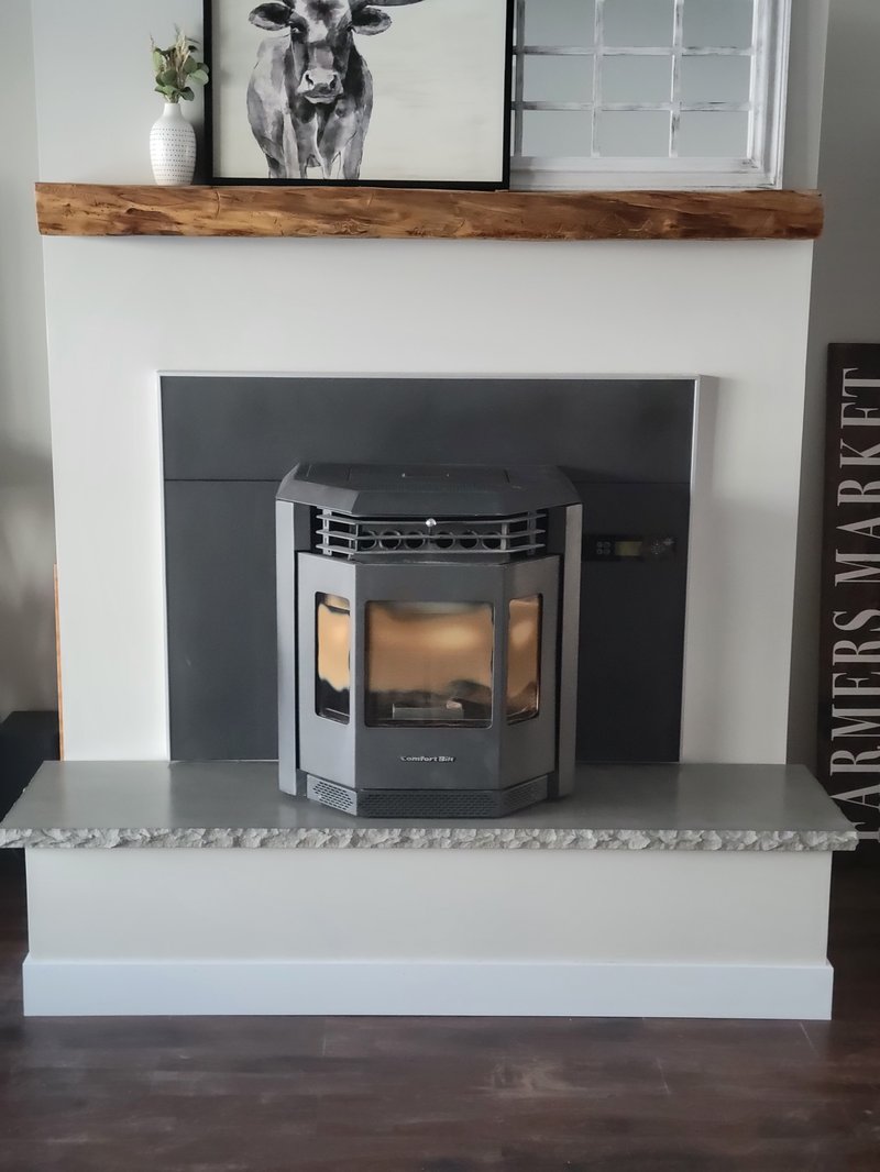 Concrete fireplace hearth bench below a mantel